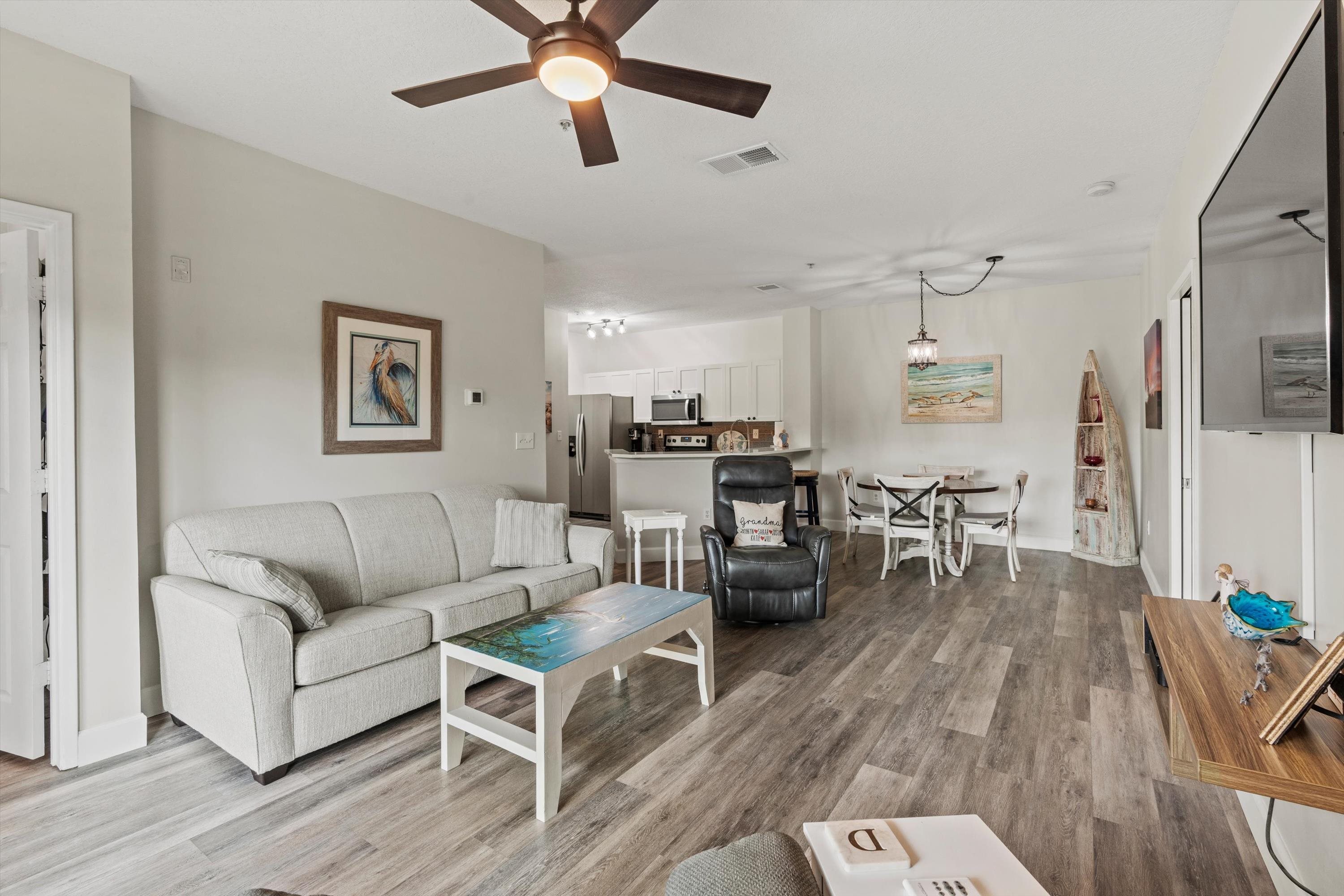 540 Florida Club Boulevard, Unit 210 St. Augustine, FL 32084 - Photo 13 of 33 Living room featuring light wood-style floors and a ceiling fan
