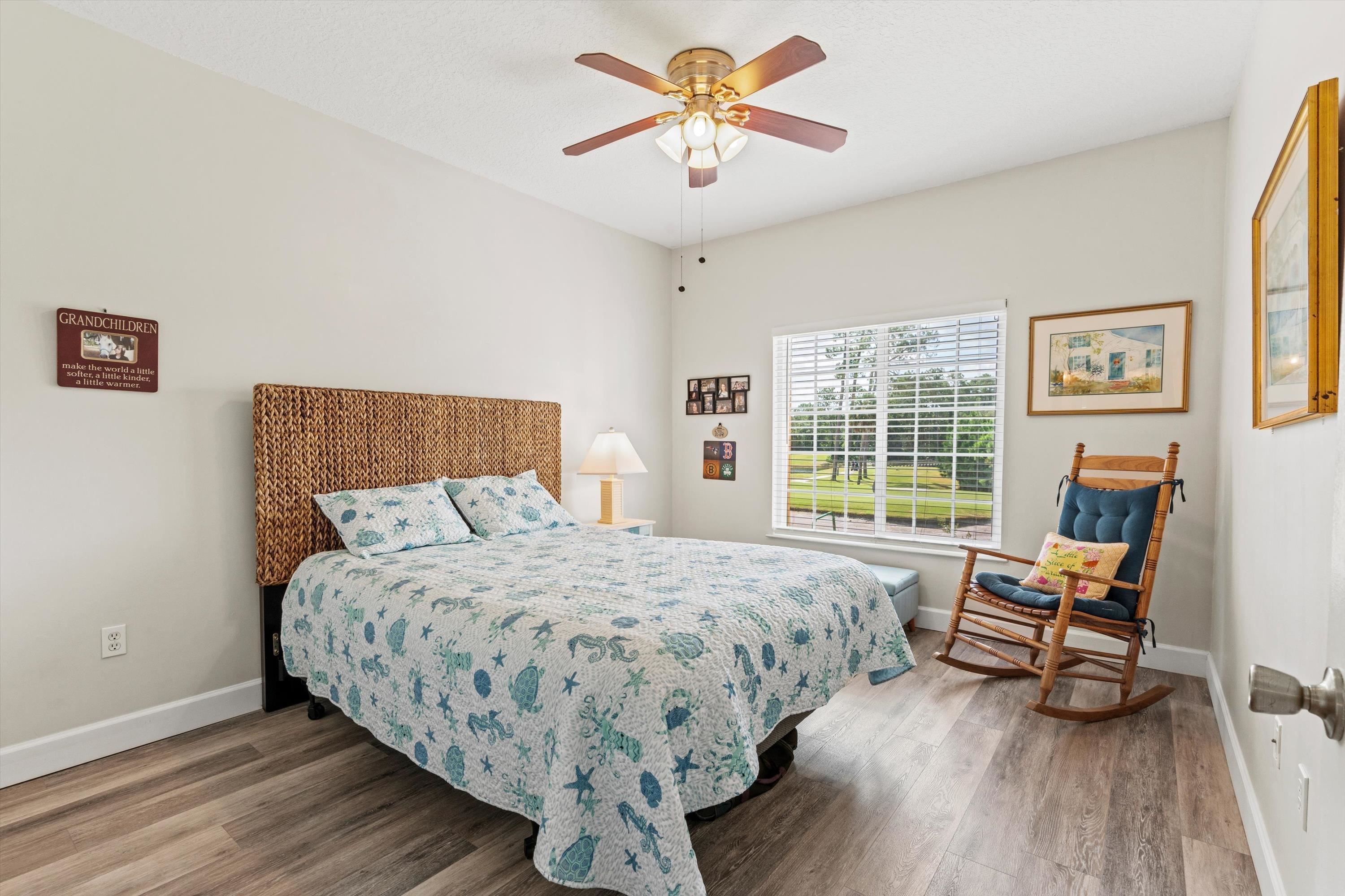 540 Florida Club Boulevard, Unit 210 St. Augustine, FL 32084 - Photo 15 of 33 Bedroom featuring a ceiling fan and wood finished floors