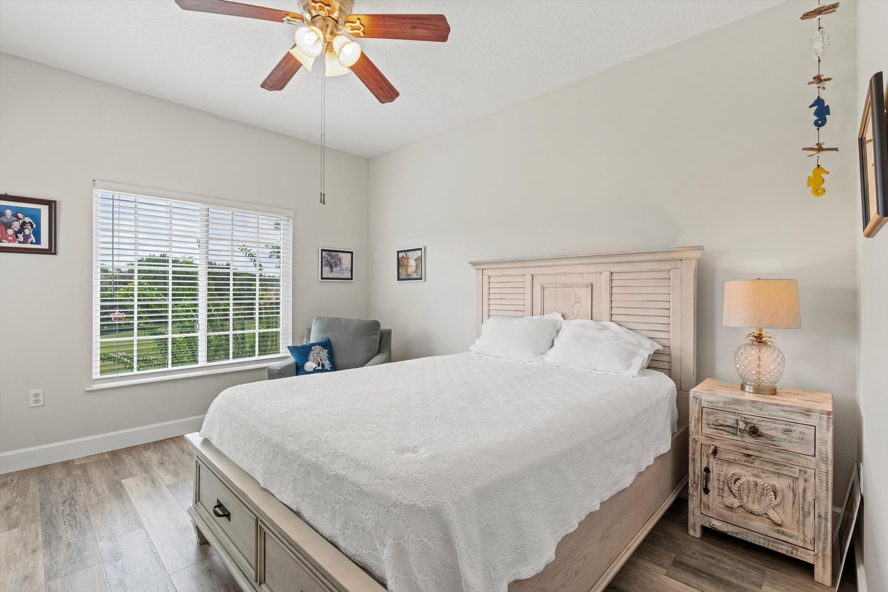 540 Florida Club Boulevard, Unit 210 St. Augustine, FL 32084 - Photo 18 of 33 Bedroom with light wood finished floors and a ceiling fan