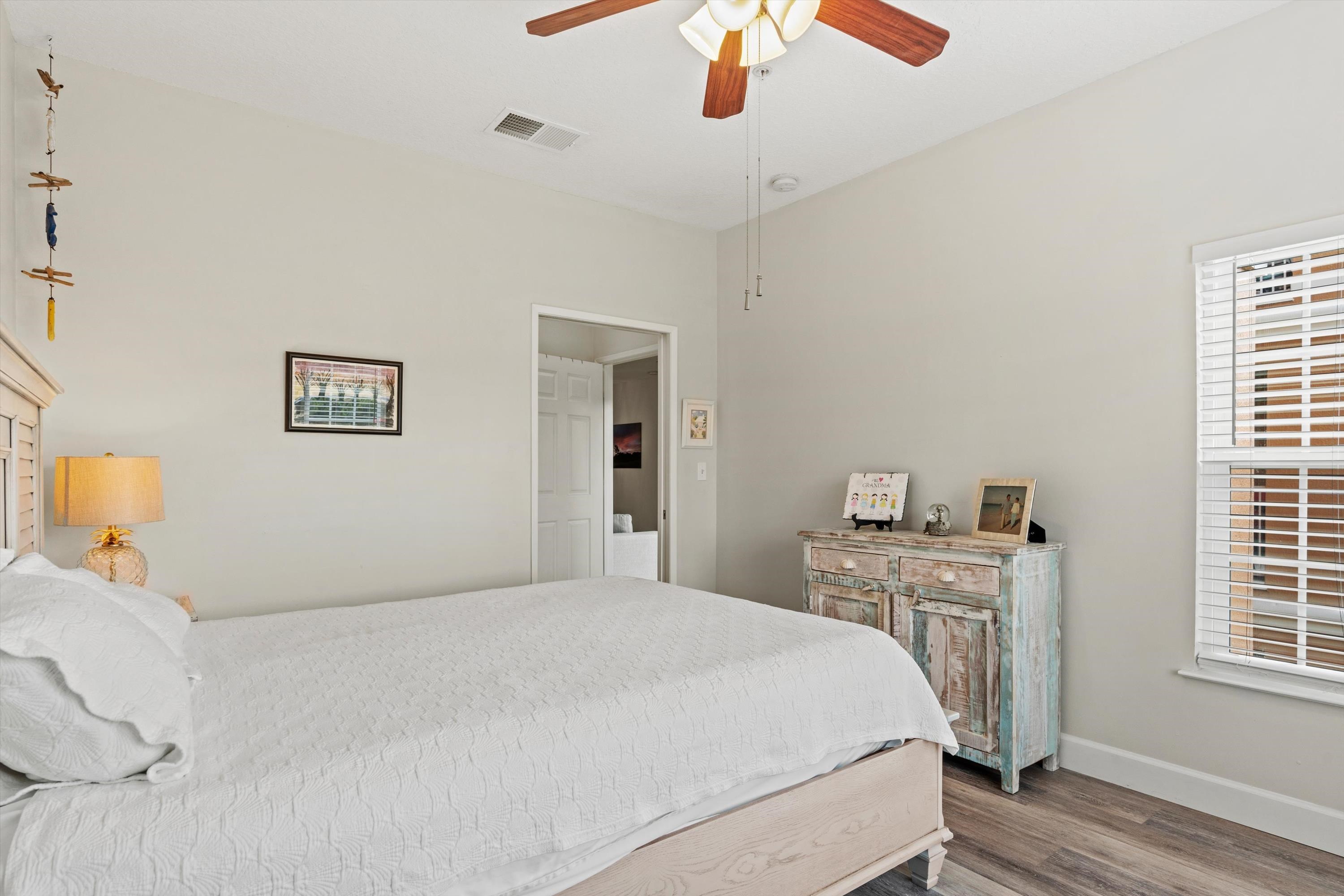 540 Florida Club Boulevard, Unit 210 St. Augustine, FL 32084 - Photo 19 of 33 Bedroom with wood finished floors and ceiling fan