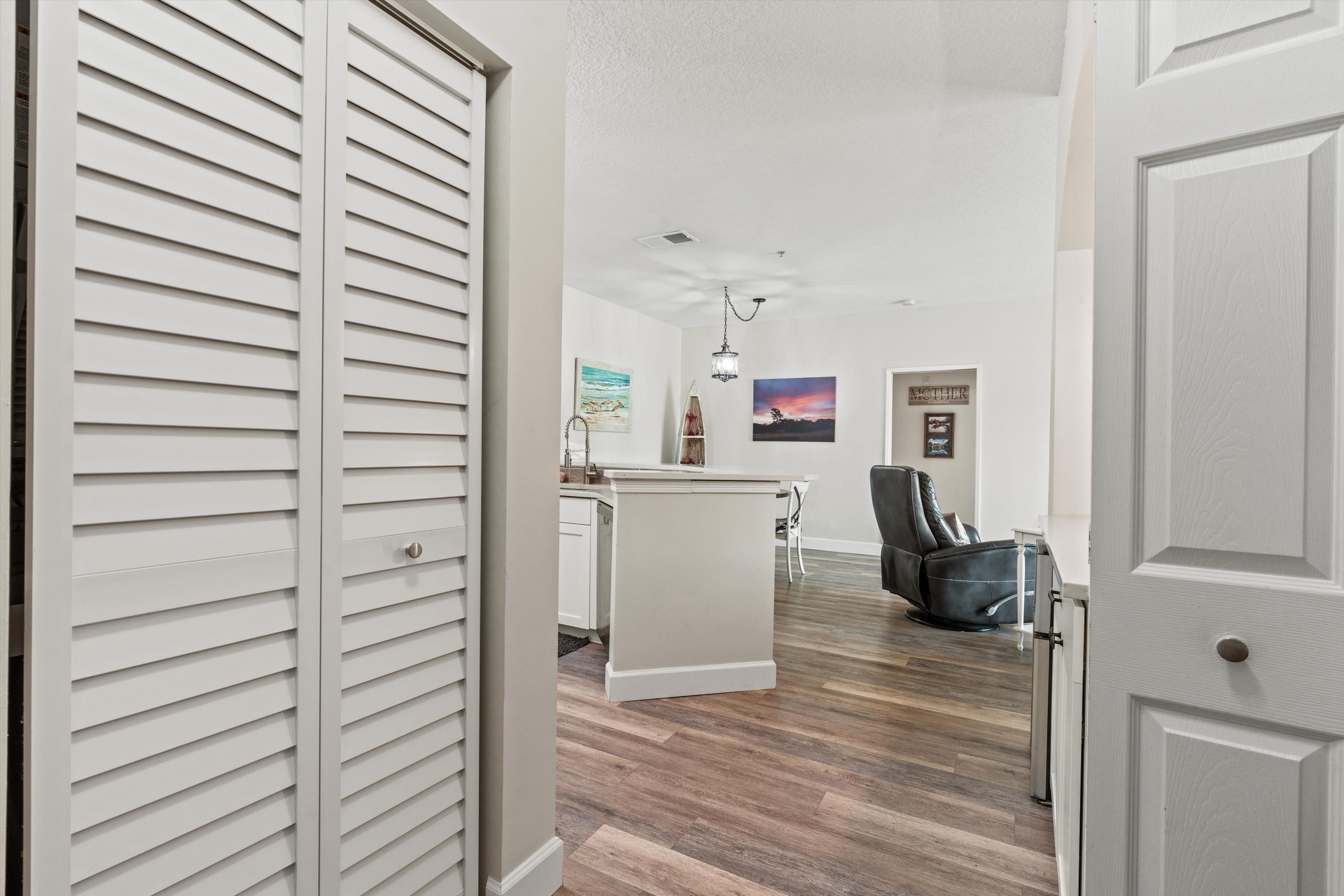 540 Florida Club Boulevard, Unit 210 St. Augustine, FL 32084 - Photo 3 of 33 Hallway featuring dark wood-style floors and baseboards