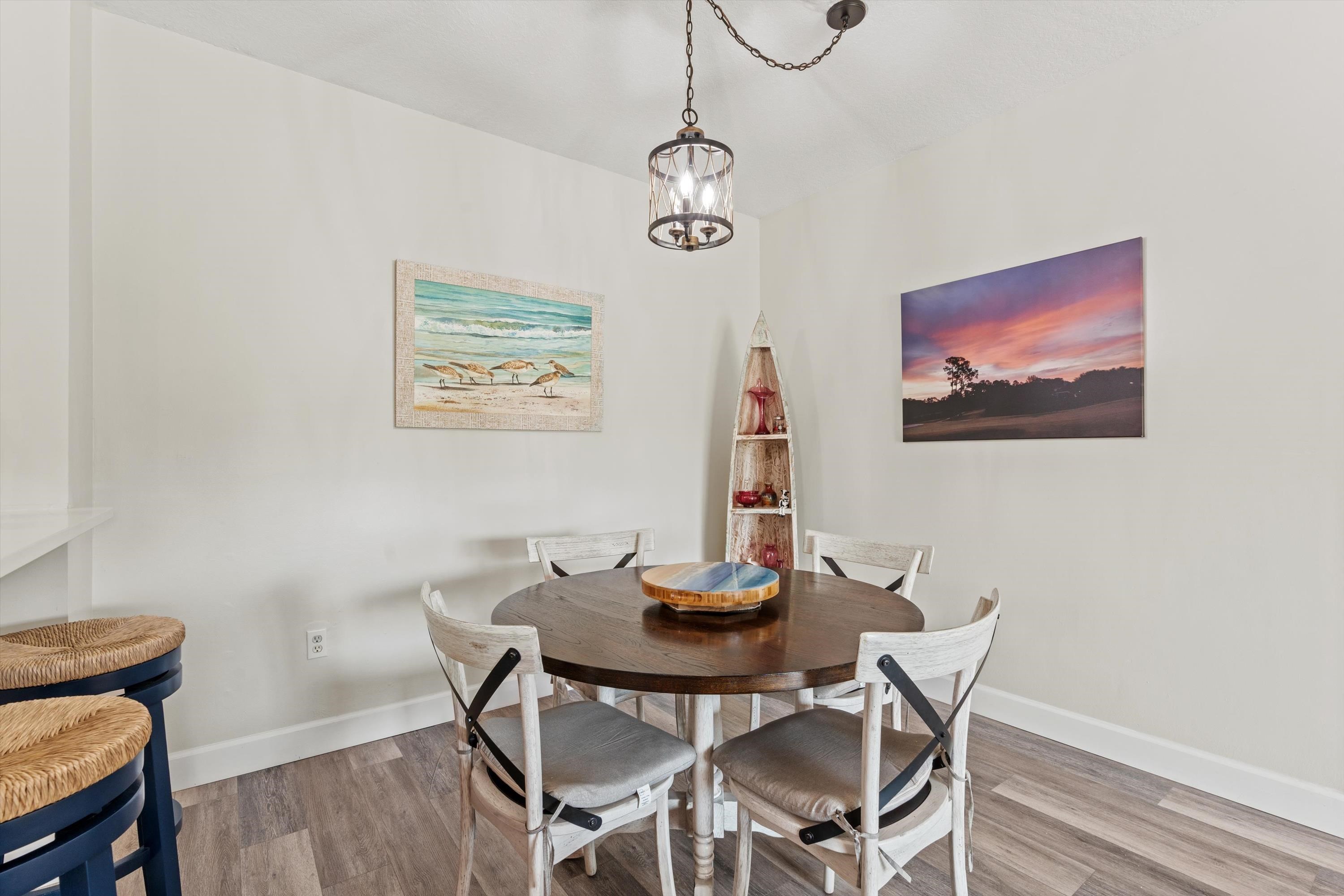 540 Florida Club Boulevard, Unit 210 St. Augustine, FL 32084 - Photo 9 of 33 Dining room featuring wood finished floors and a chandelier
