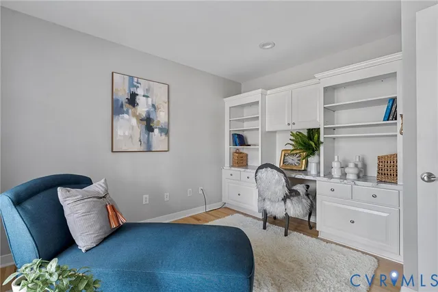 a bedroom with furniture and a window