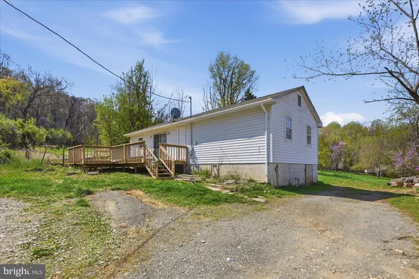 a view of a house with a yard and garage