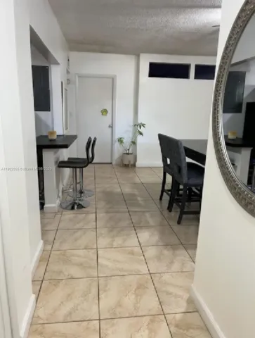 a view of a workspace with furniture