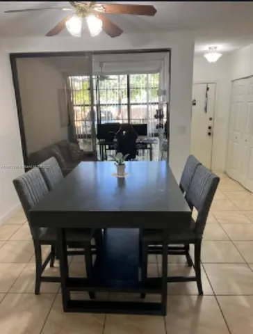 a view of a dining room with furniture and window