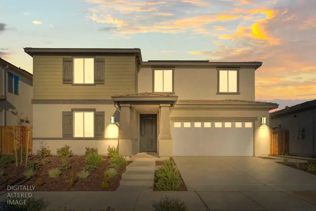 a front view of a house with a garage