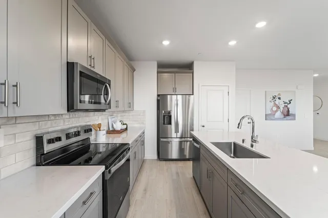 a spacious bedroom with a bed and a couch