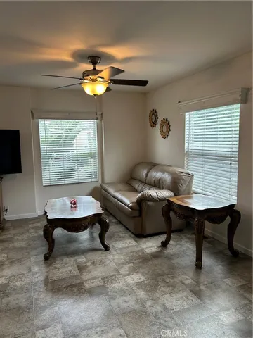 a view of a livingroom with furniture and window
