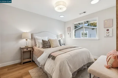 a bedroom with bed and a window