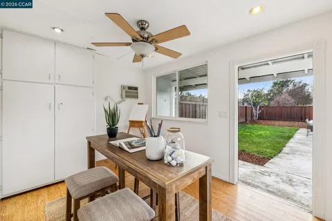 a view of a workspace with furniture and a potted plant