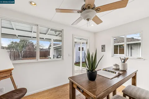 a view of a patio with couches chairs and a yard