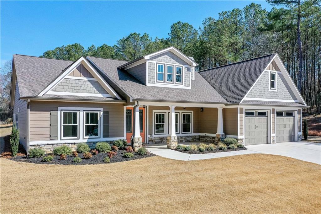 3667 Jones Mill Road Carrollton, GA 30116 - Photo 1 of 66 a front view of a house with yard and green space