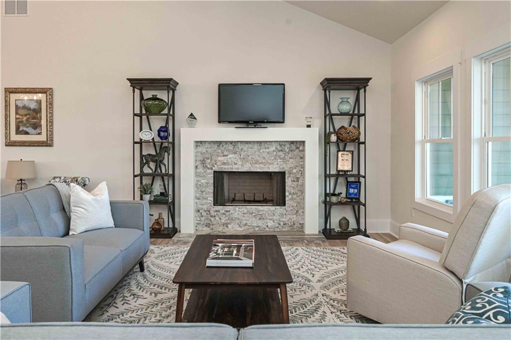 3667 Jones Mill Road Carrollton, GA 30116 - Photo 11 of 66 a living room with furniture and a fireplace