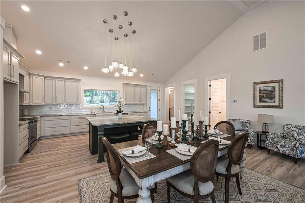 3667 Jones Mill Road Carrollton, GA 30116 - Photo 14 of 66 a kitchen with a table and chairs in it
