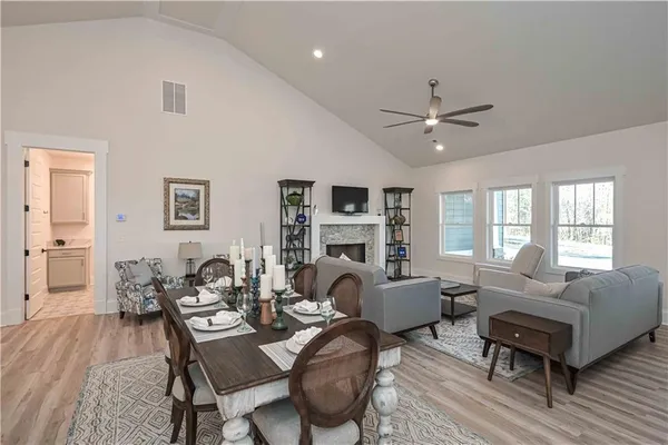 a view of a dining room with furniture and a fireplace