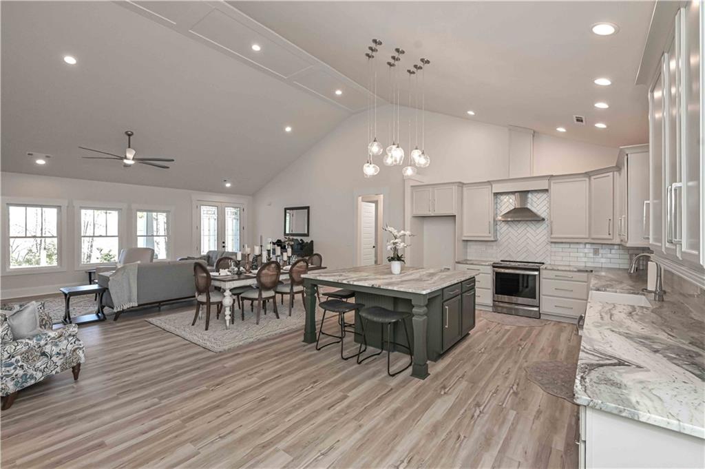 3667 Jones Mill Road Carrollton, GA 30116 - Photo 21 of 66 a large kitchen with a table and chairs