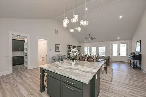 a stove top oven sitting inside of a kitchen