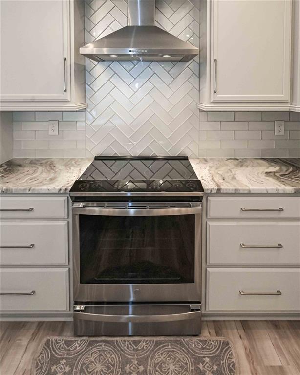 3667 Jones Mill Road Carrollton, GA 30116 - Photo 26 of 66 a stove top oven sitting inside of a kitchen