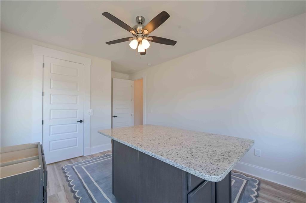 3667 Jones Mill Road Carrollton, GA 30116 - Photo 36 of 66 wooden floor in an empty room with a window