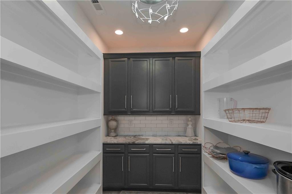 3667 Jones Mill Road Carrollton, GA 30116 - Photo 40 of 66 a kitchen with a stove and a refrigerator