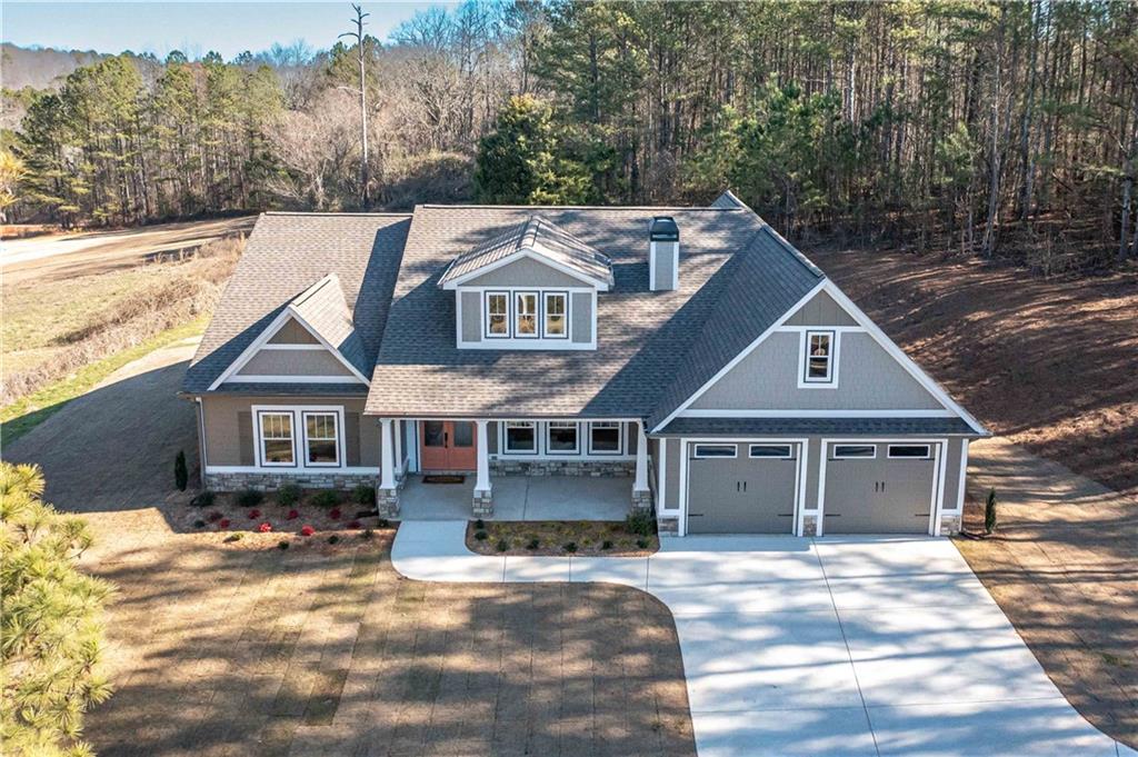 3667 Jones Mill Road Carrollton, GA 30116 - Photo 4 of 66 a front view of a house with a yard