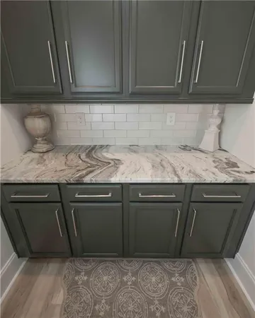 a white bath tub sitting next to a white sink