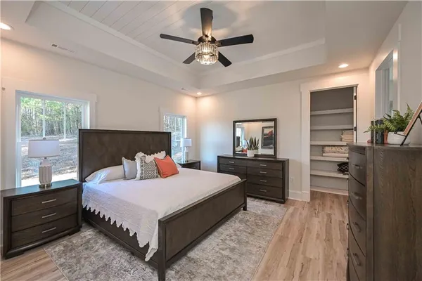 a view of a closet with wooden floor
