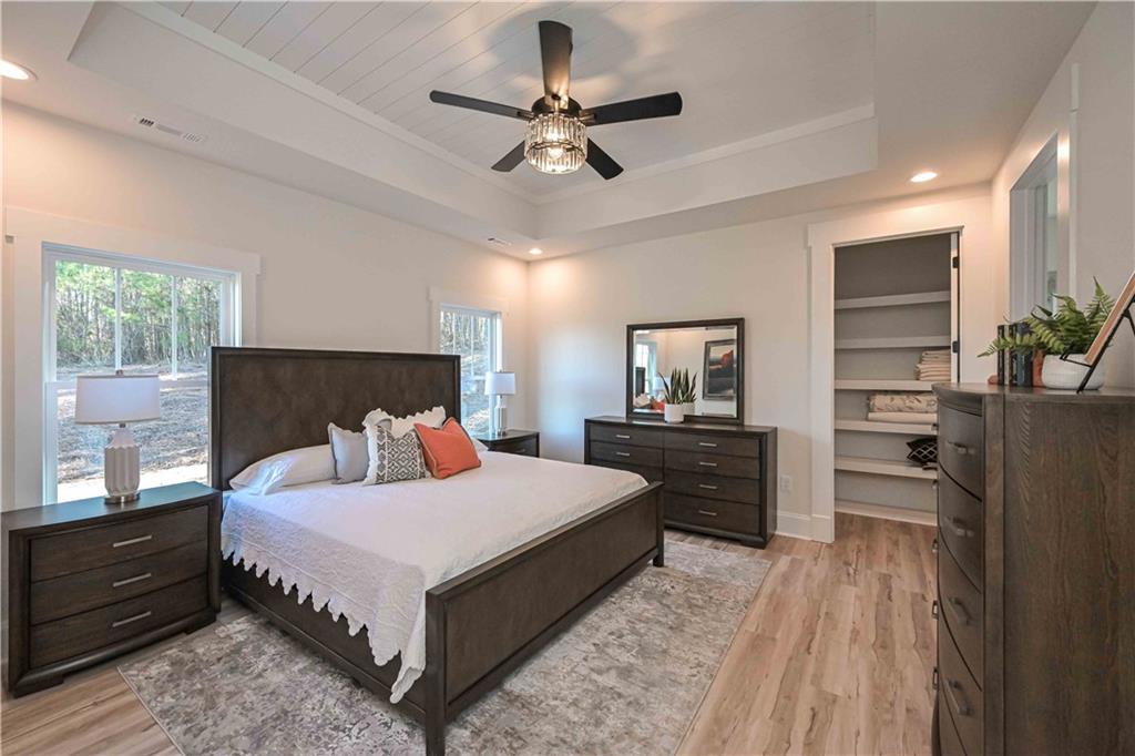 3667 Jones Mill Road Carrollton, GA 30116 - Photo 44 of 66 a bedroom with a bed and a dresser