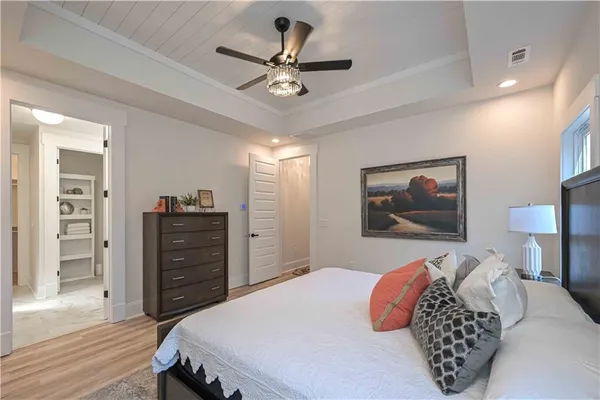 a view of a livingroom with a ceiling fan and window