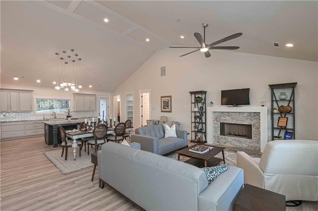 3667 Jones Mill Road Carrollton, GA 30116 - Photo 5 of 66 a living room with furniture fireplace and a television