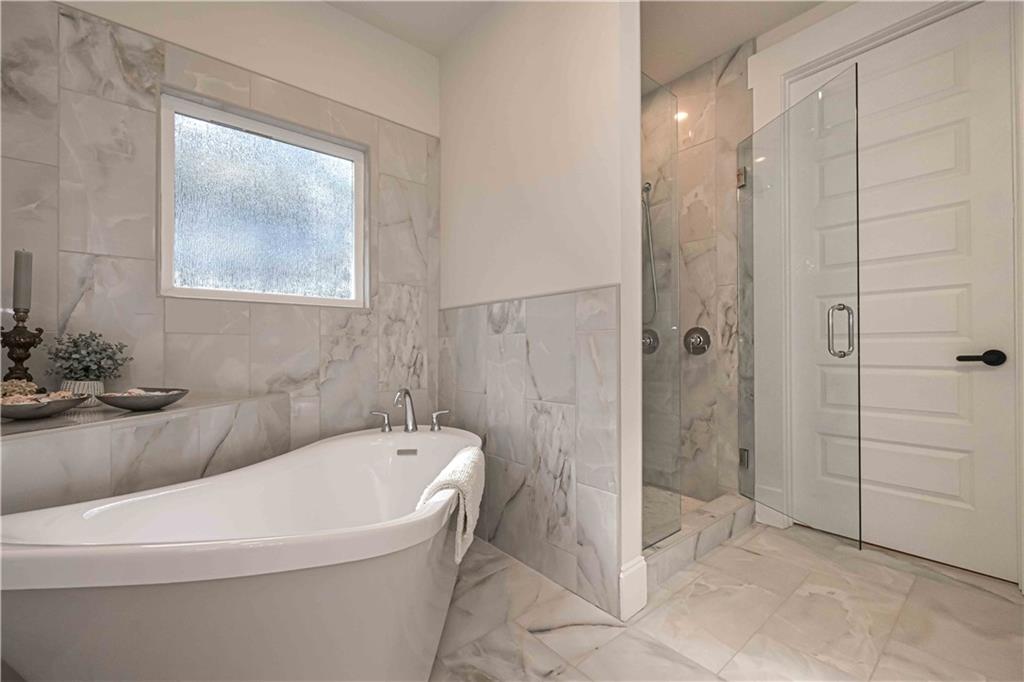 3667 Jones Mill Road Carrollton, GA 30116 - Photo 53 of 66 a white bath tub sitting next to a white sink