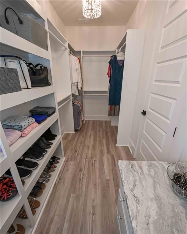 3667 Jones Mill Road Carrollton, GA 30116 - Photo 57 of 66 a view of a closet with wooden floor