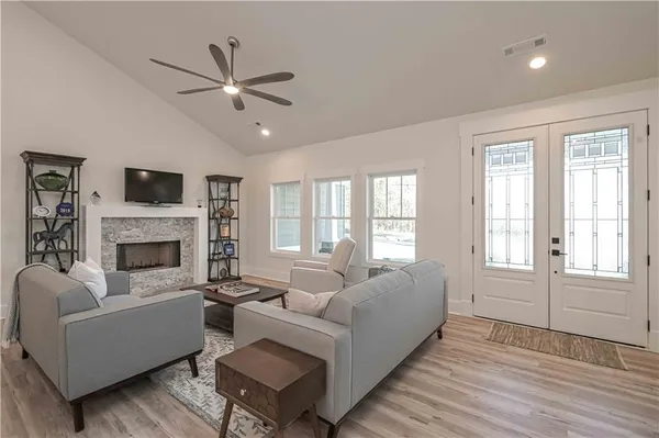 a living room with furniture and a fireplace