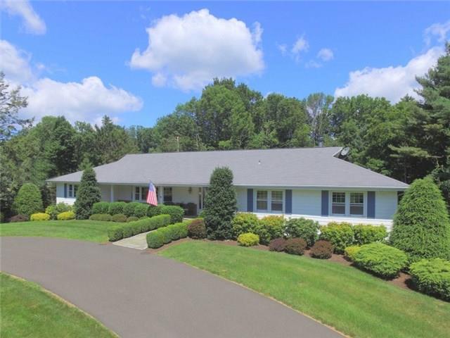 141 Remington Road Ridgefield, CT 06877 - Photo 1 of 1 a front view of a house with a yard and garage