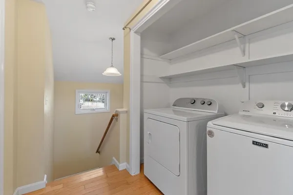 a view of storage and utility room with washer and dryer