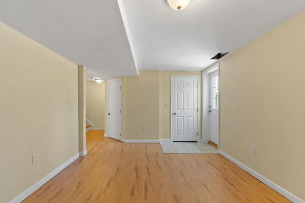 a view of wooden floor and windows in a room