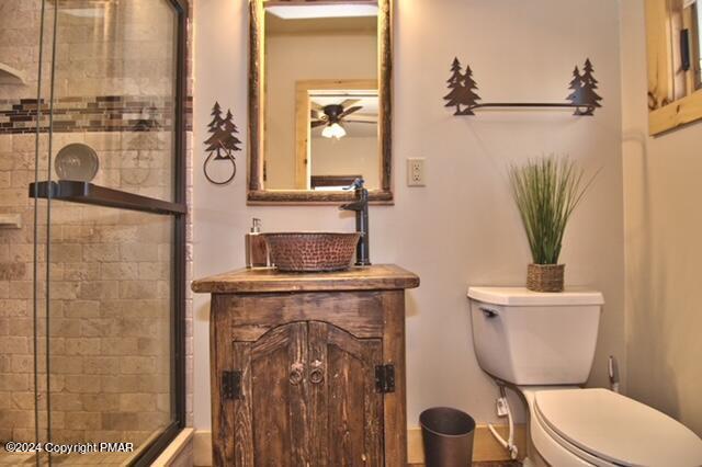 5187 Woodland Avenue Pocono Pines, PA 18350 - Photo 22 of 40 a bathroom with a toilet a sink and mirror