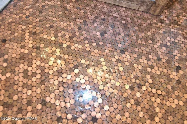 a bathroom with a granite countertop sink a toilet and a mirror