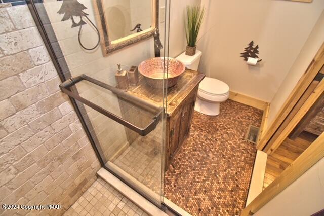 5187 Woodland Avenue Pocono Pines, PA 18350 - Photo 27 of 40 a bathroom with a granite countertop sink a toilet and a mirror