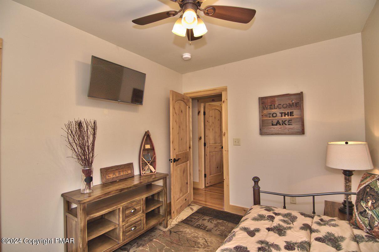 5187 Woodland Avenue Pocono Pines, PA 18350 - Photo 3 of 40 a view of a livingroom with furniture and chandelier