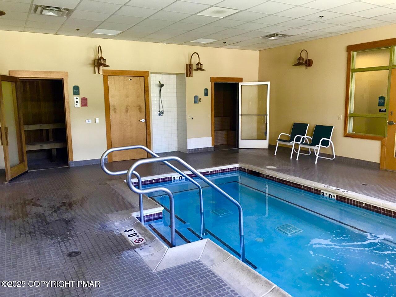 5187 Woodland Avenue Pocono Pines, PA 18350 - Photo 40 of 40 a living room with furniture a flat screen tv and a table