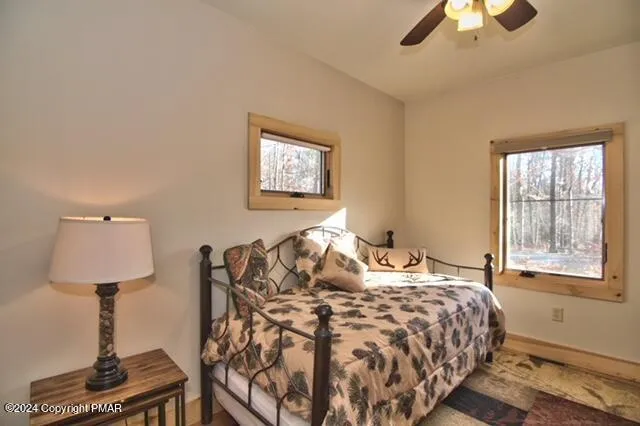 a bedroom with a bed and a lamp on table