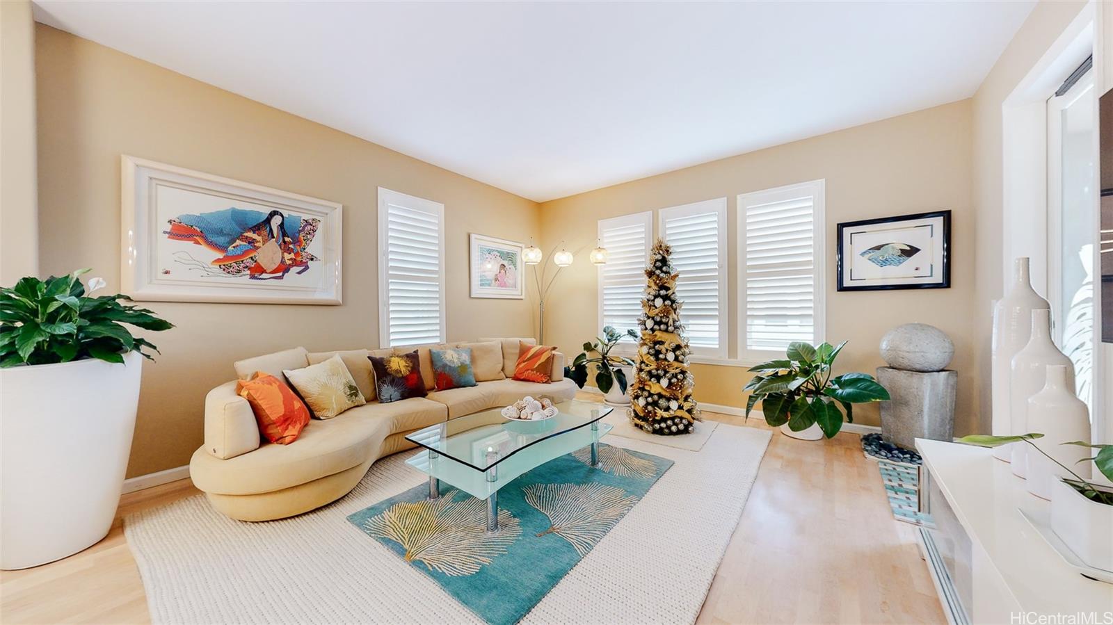 520 Lunalilo Home Road, Unit 6301 Honolulu, HI 96825 - Photo 1 of 1 a living room with furniture and a potted plant