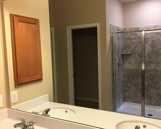 a bathroom with a tub and shower