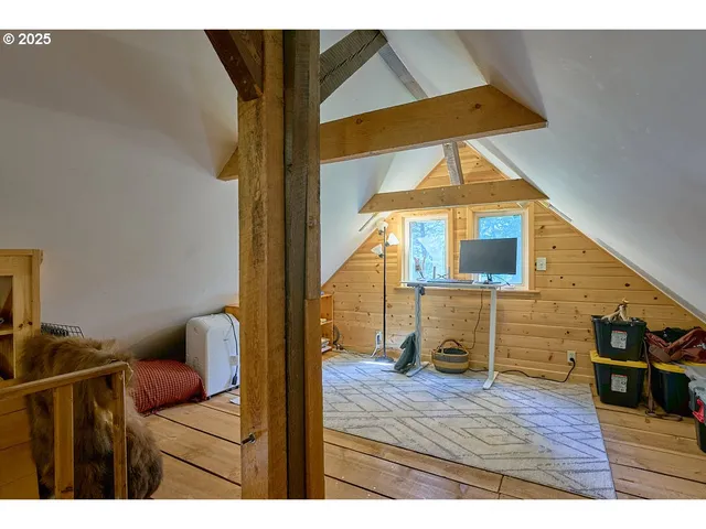 a view of living room filled with furniture and wooden floor
