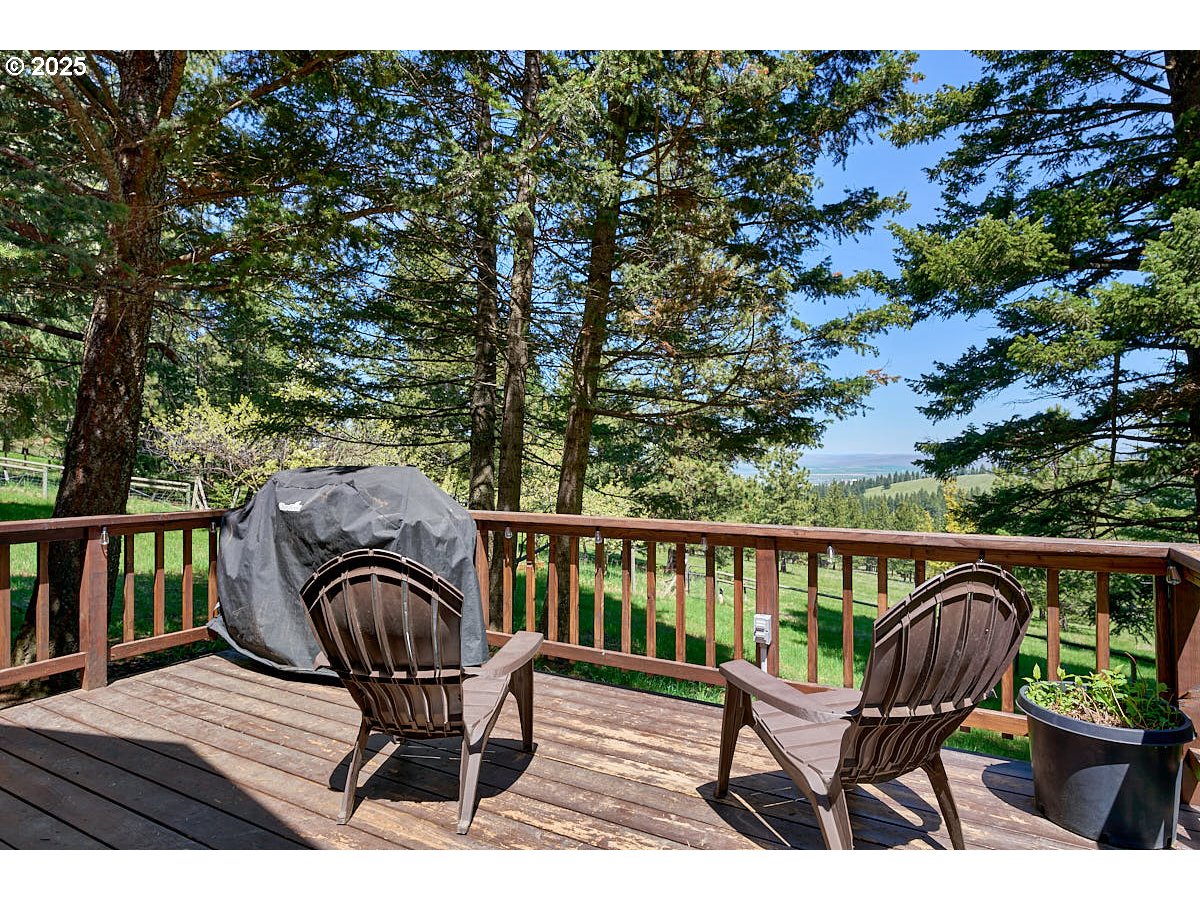 83863 Ollokot Lane Joseph, OR 97846 - Photo 16 of 25 a view of a chair in wooden deck