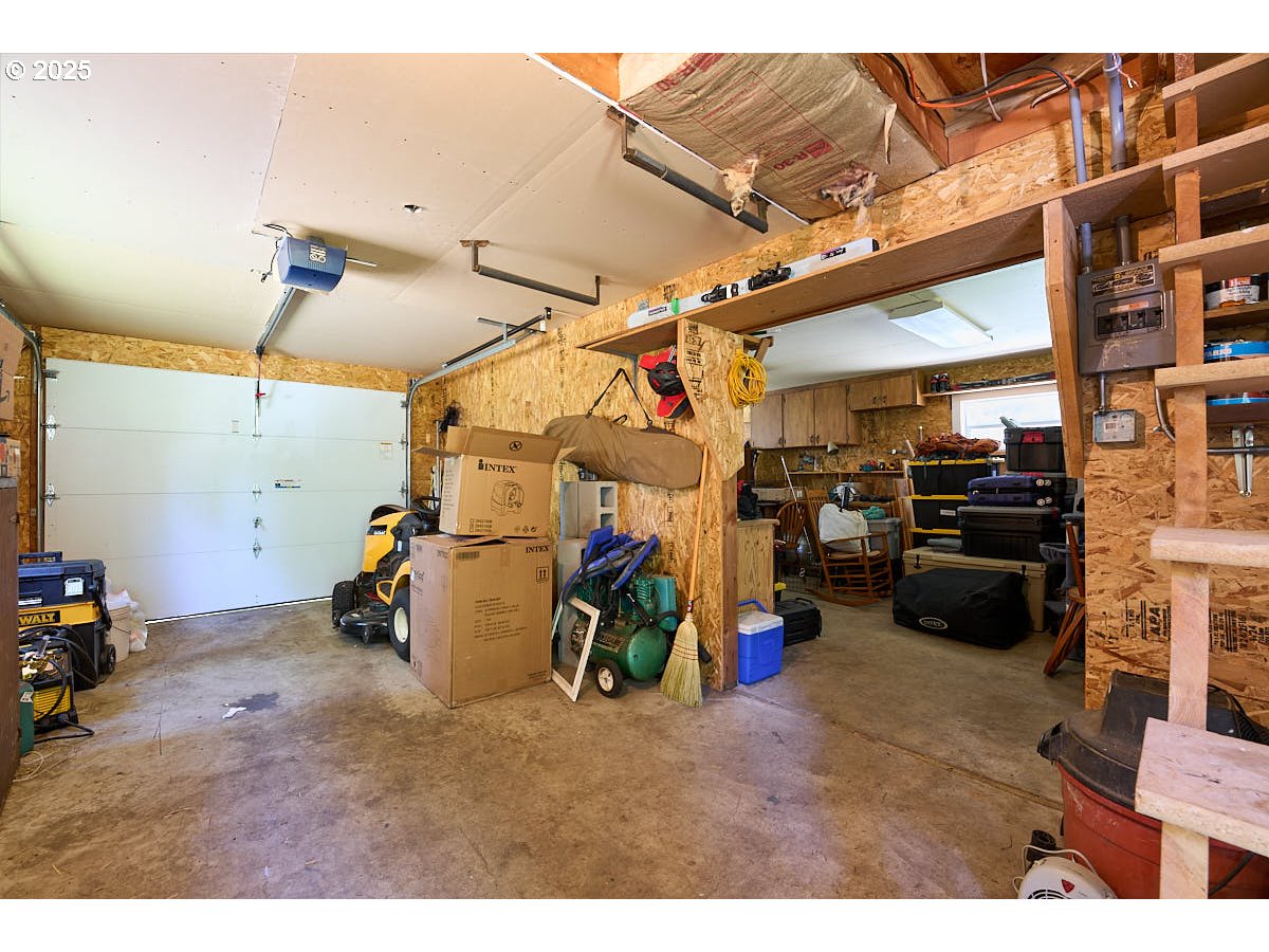 83863 Ollokot Lane Joseph, OR 97846 - Photo 19 of 25 a view of a garage with an bike and chair
