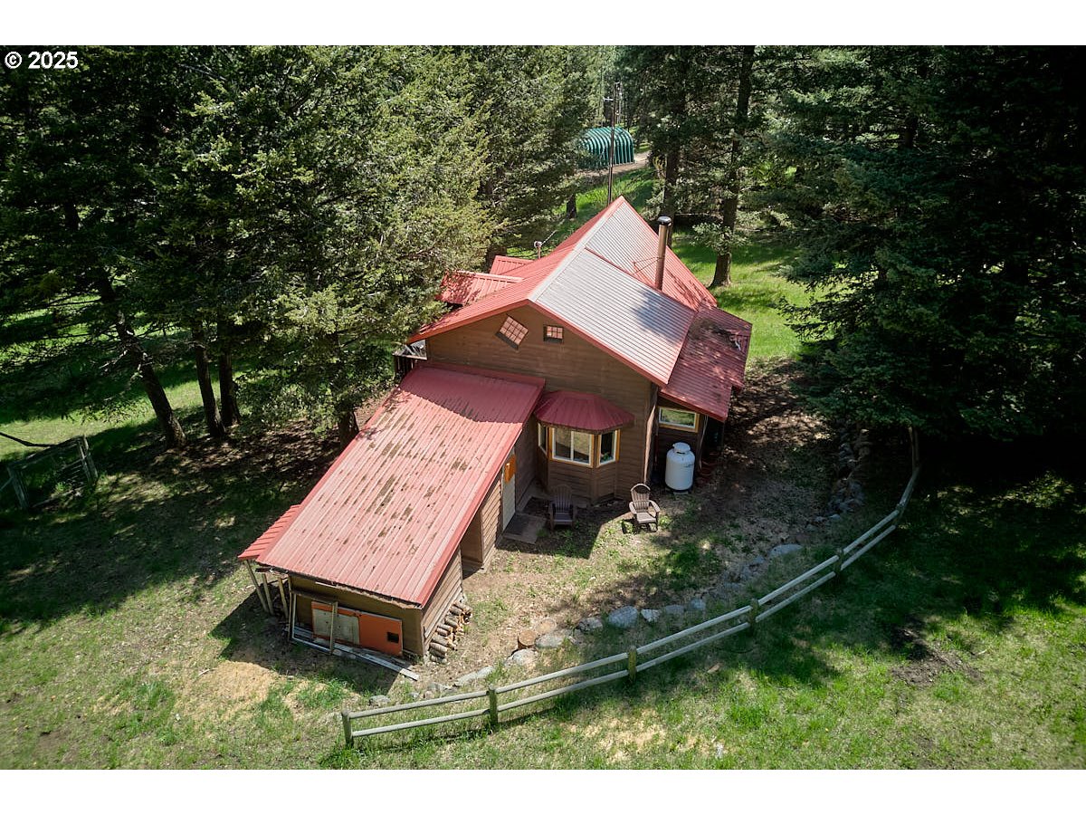 83863 Ollokot Lane Joseph, OR 97846 - Photo 2 of 25 a picture of a tree in front of a house