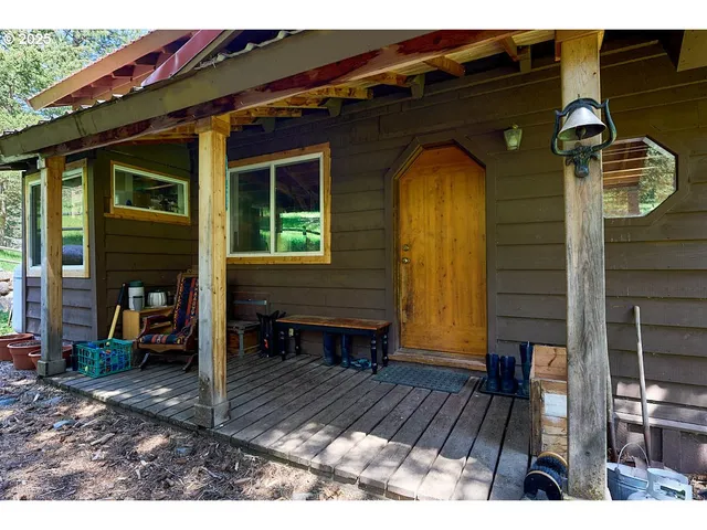 a view of a house with a door and wooden floor
